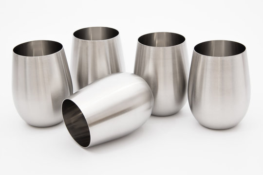 Modern metal stainless steel inox glasses for wine - for camping or for elegant interior alternative - isolated on white