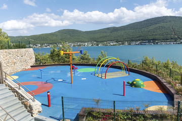 Colorful children playground in sea resort with sea view