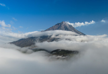 Fototapeta na wymiar Panorama with the top of Koryaksky volcano, Kamchatka peninsula, Russia