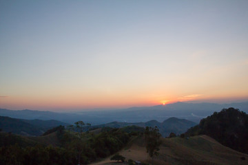 Naklejka na ściany i meble landscape sunset on mountain hills at NAN, Thailand
