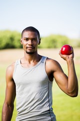 Fototapeta premium Male athlete holding shot put ball