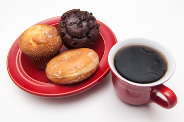 deilicous donut and muffin , drinks on plate on white backgrounds