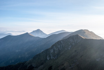 autumn morning panorama of Krivanska Mala Fatra mountain range from Chleb hill above Vratna dolina in Slovakia with blue sky © honza28683