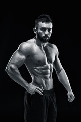Fototapeta na wymiar Muscular bodybuilder guy doing posing