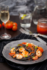 Black spaghetti with shrimps and red caviar