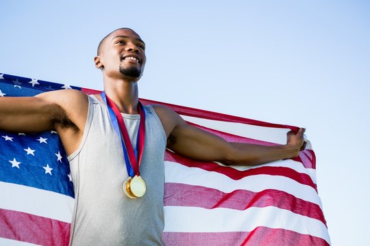 Athlete posing with American flag
