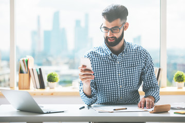 Casual guy using cellphone