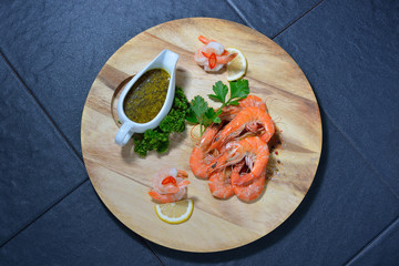 Cooked shrimps,prawns with seasonings on chopping board