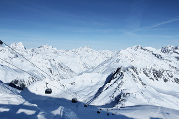 Fototapeta na wymiar Ski lift in mountains