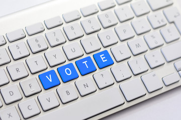 VOTE writing on white keyboard