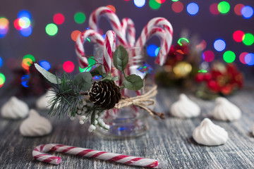 Christmas Candy Canes in jar. Christmas candy on table on light background