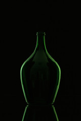 Silhouette of elegant and very old wine bottle