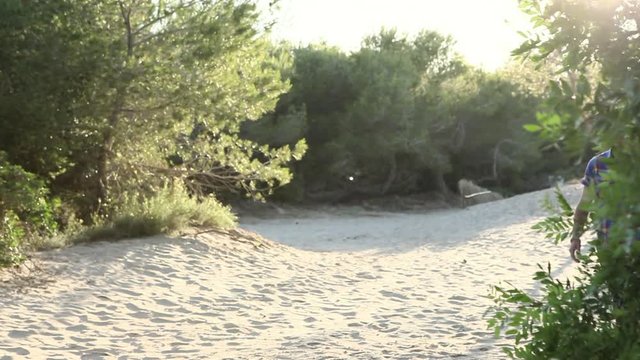 Young couple walking along sand