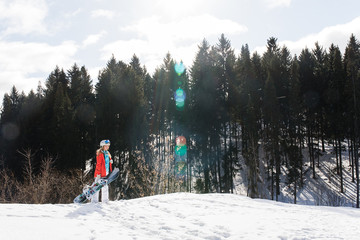 Woman snowboarder on the slopes frosty winter day