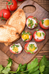 Baked eggs in tomato cups. 