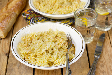 Cooked corkscrew shaped pasta Fusilli with cheese