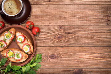 Baked eggs in tomato cups. Breakfast.