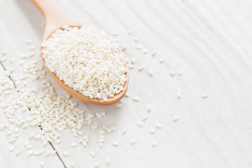 white sesame seeds on wooden spoon,Healthy Food White on the woo