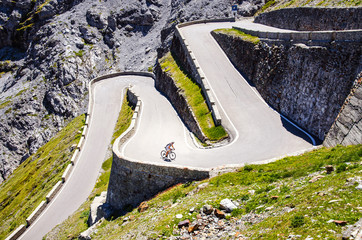 Fototapeta premium Turns of famous Passo Dello Stelvio Climb. Italian - Swiss border, Alpen. Original wallpaper with road, or theme of transport