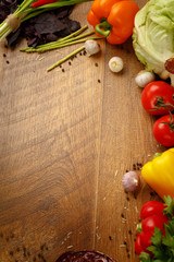 wooden background with vegetables and spices
