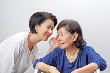 Asian elderly woman hearing loss , Hard of hearing.