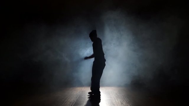 Man dancing trendy dancing in smoke