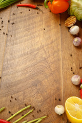 wooden background with vegetables and spices
