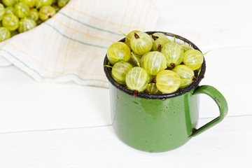 Gooseberry in an old metal green mug