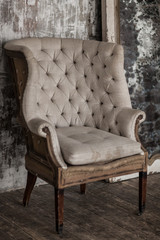 White textile classical style sofa in vintage room. White old ba