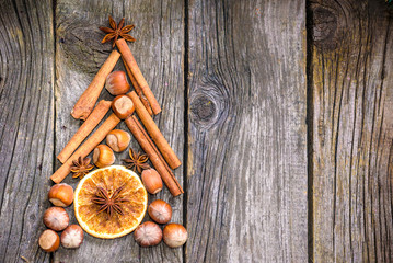 Christmas tree made of nuts, spices and dried oranges. Viewed from above