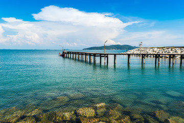 Obraz premium The beach and Wooden bridge Viewpoint in beautiful blue sky, sea