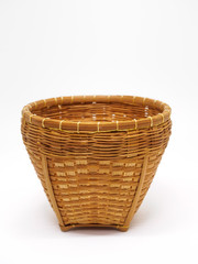 Empty brown wicker woven basket isolated