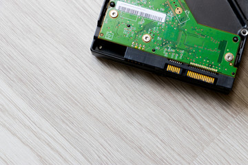 Close up inside of Harddisk on wood background