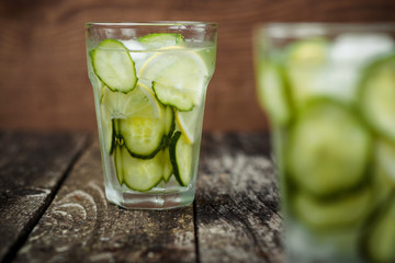 Detox water with cucumber and lemon .