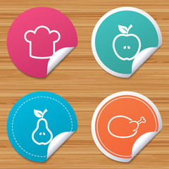 Round stickers or website banners. Food icons. Apple and Pear fruits with leaf symbol. Chicken hen bird meat sign. Chef hat icons. Circle badges with bended corner. Vector
