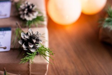 Decorated gift boxes and garland on the wooden background