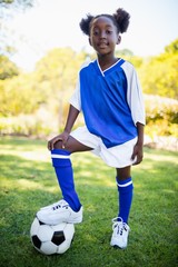 Portrait of girl standing with soccer balloon © WavebreakMediaMicro
