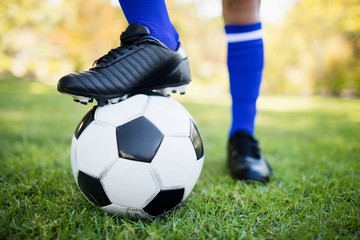 Close up view of balloon under football boots in park