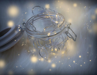 Fototapeta na wymiar Magic fairy lights in a glass jar decoration