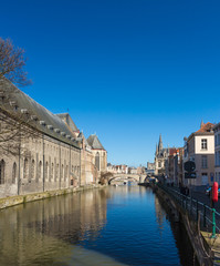 Ghent Old Town Architecture Cityscape and Canal Reflection. View of pictures houses along channel in Ghent.