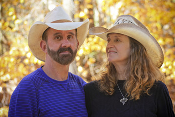A Married Couple with Autumn Leaves Behind