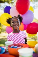 Fototapeta na wymiar Portrait of cute girl smiling during a birthday party