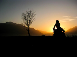 Sunset motorbike rider