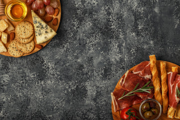 Cheese and meat appetizer selection, top view.