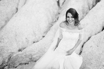 Fototapeta na wymiar beautiful bride in a white dress walking outdoors