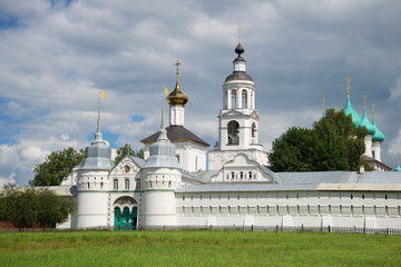 Fototapeta na wymiar View of the Sacred gate and St. Nicholas Church in the cloudy July afternoon. Vvedensky Tolga Convent, Yaroslavl. Golden Ring of Russia