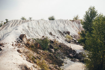 beautiful sand quarry with large stones and trees