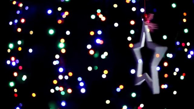 star with colorful lights on a black background