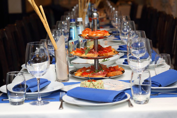 serving banquet table in a restaurant in blue and white style