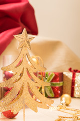 Christmas ornaments on golden fabric, closeup